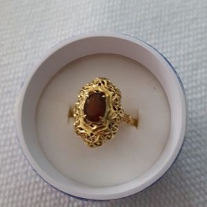 14k gold ring with brown topaz.